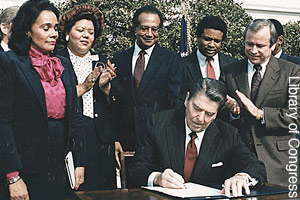 President Ronald Reagan signing bill for <br>Martin Luther King Day