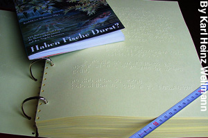 A braille book compared to a printed book