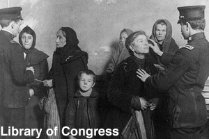 Immigrants having their eyes examined