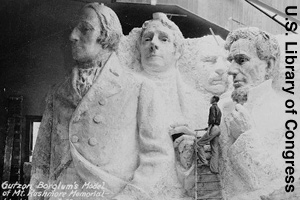 The original plans were to show the presidents from their waists up.