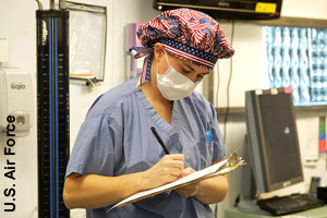 A nurse keeping records on each patient
