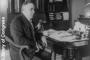 President McKinley sitting at his desk