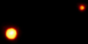 Picture of Pluto and its moon, Charon, taken by the Hubble Space Telescope